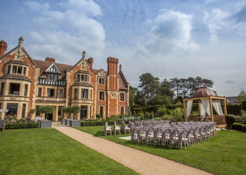 Outdoor ceremony chairs on the lawn of a country house wedding venue
