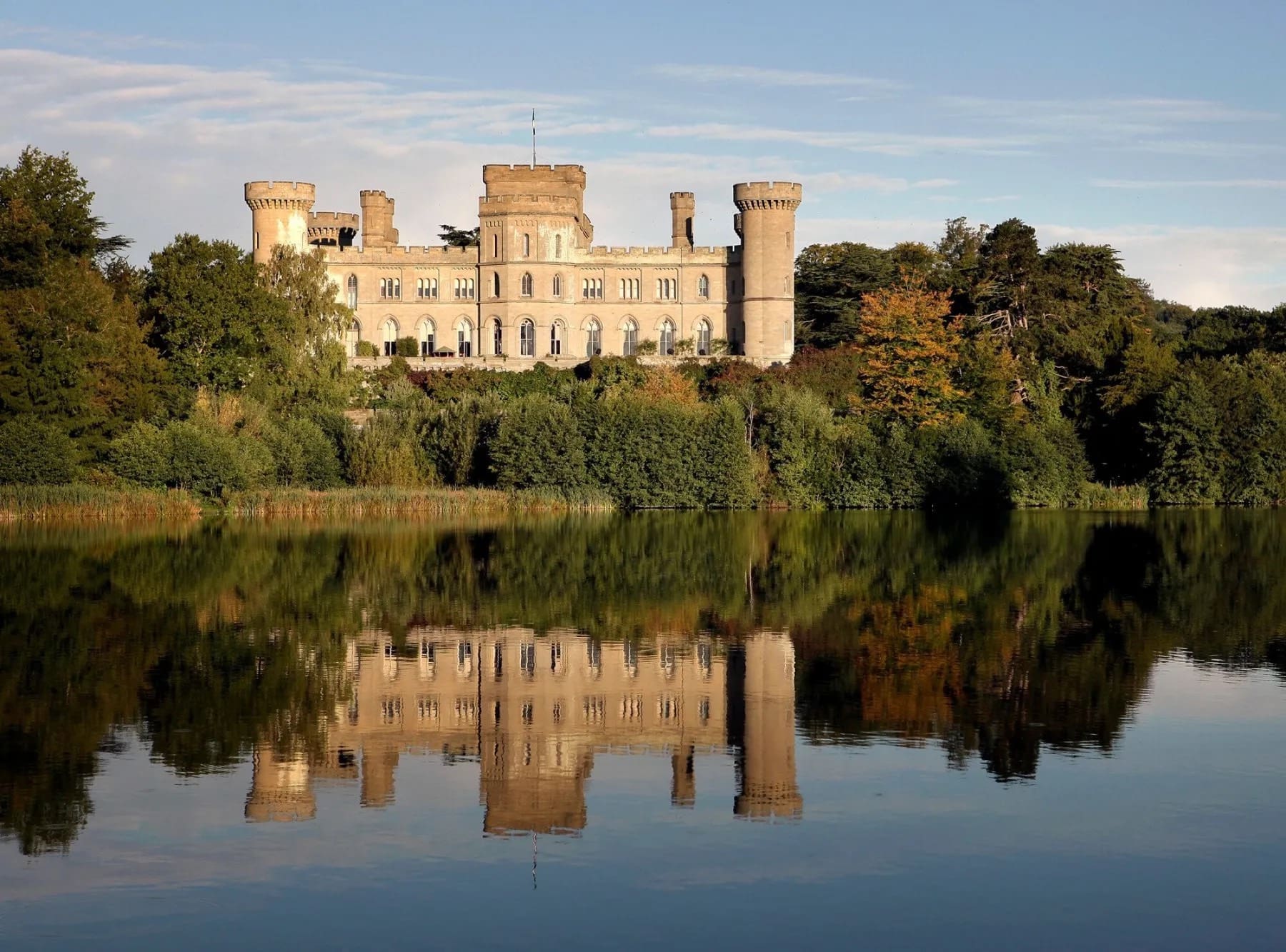Eastnor Castle reflected in the lake on a summer evening