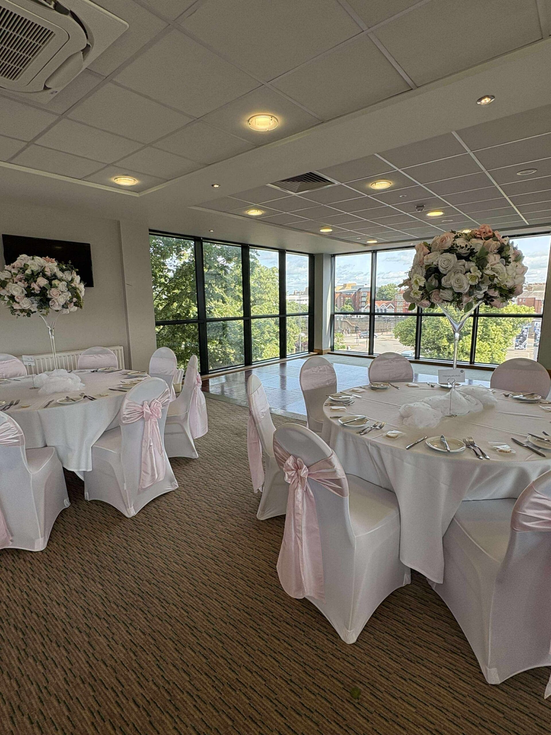Round tables with white chair covers at Worcestershire County Cricket Club