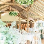Wedding ceremony backdrop with floral arch and coordinated decor styling by The Wedding House in Worcestershire